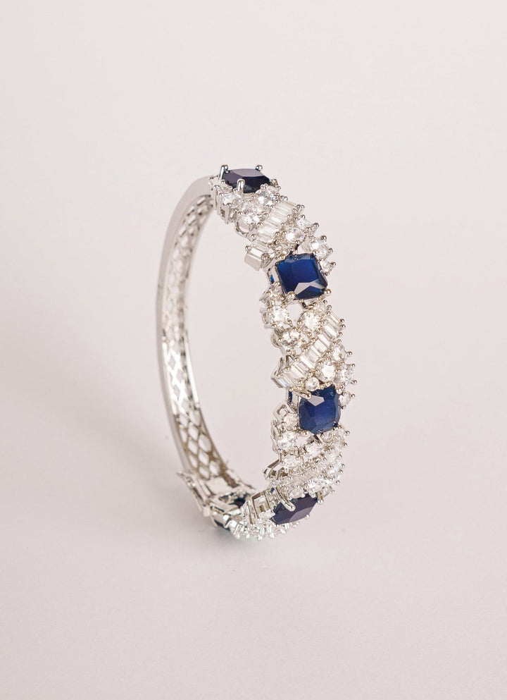 White Finish Diamond And Blue Stone Bracelet Zevar by Geeta - Fabilicious Fashion