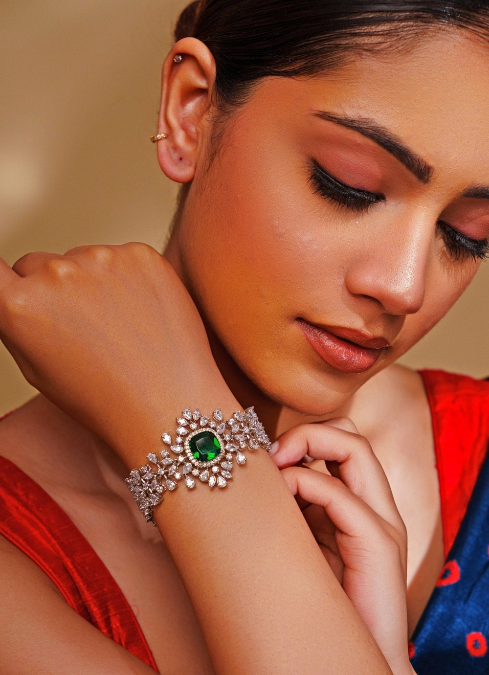White Finish Diamond And Emerald Green Bracelet Zevar by Geeta - Fabilicious Fashion