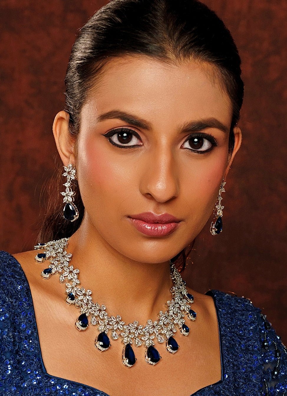 White Finish Diamond Necklace Set With Blue Stones - Zevar