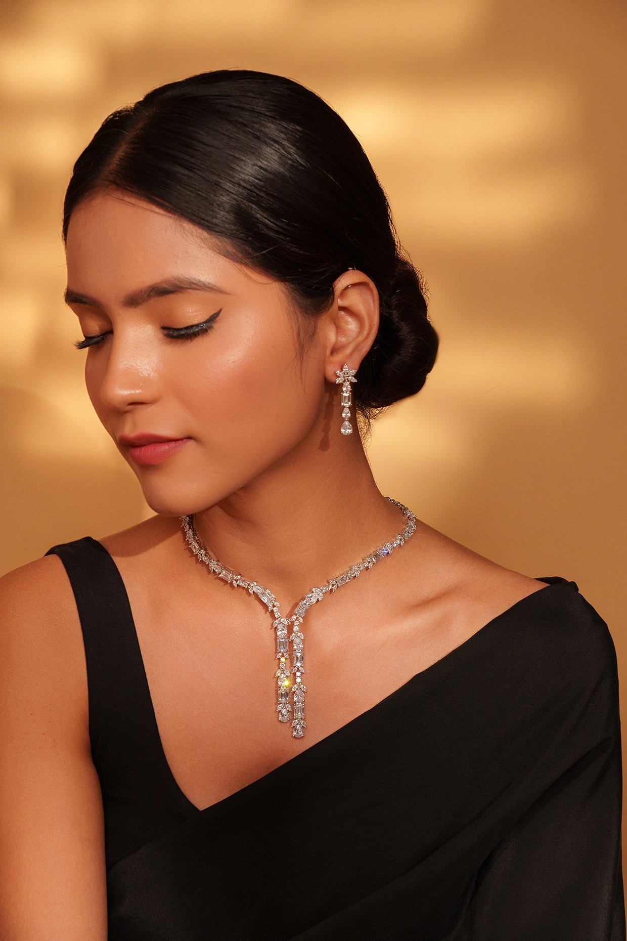 White-finish diamond pendant necklace for a golden lehenga