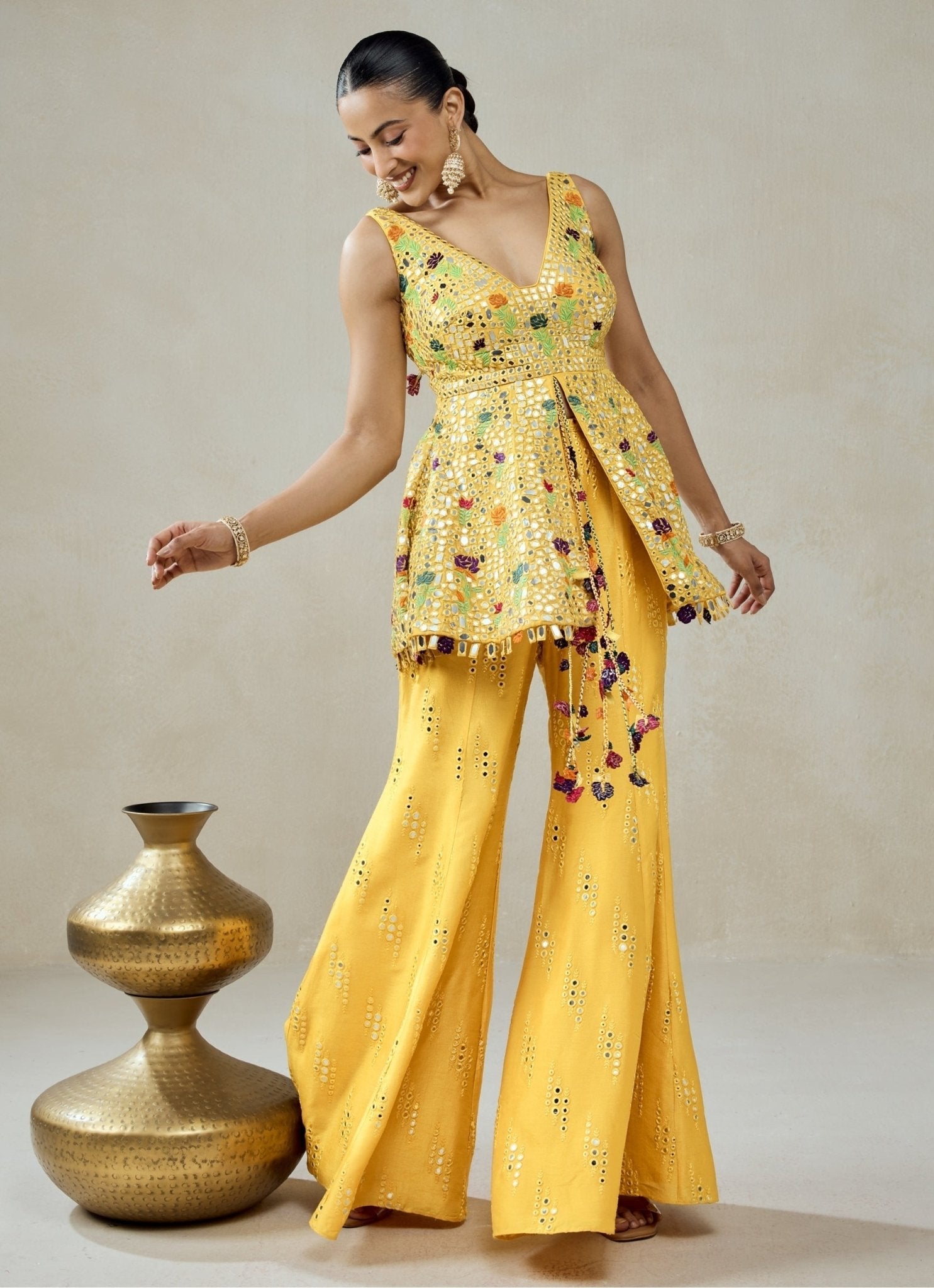 Yellow georgette peplum sharara set for the sister of the bride or groom