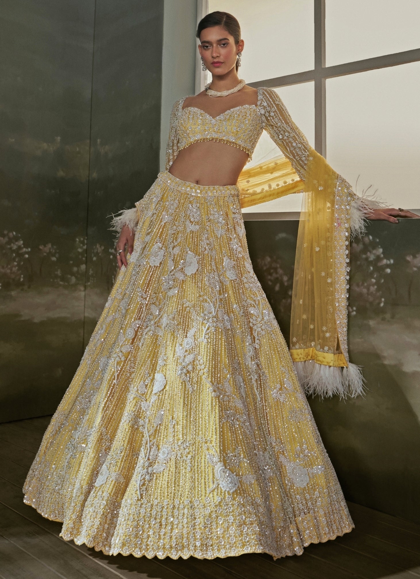 Yellow soft net modern lehenga by Nitika Gujral