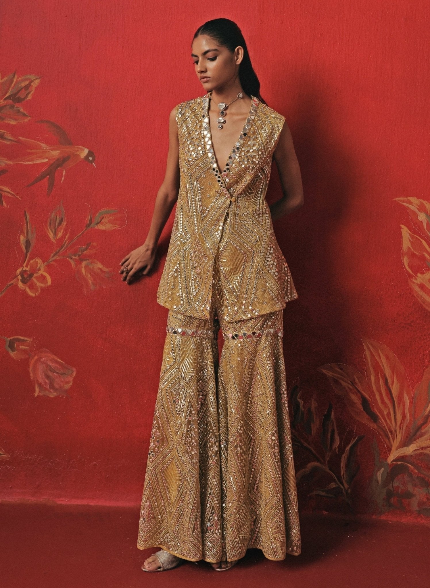 Yellow mirrorwork peplum kurta sharara set for an Indian wedding guest in the UK