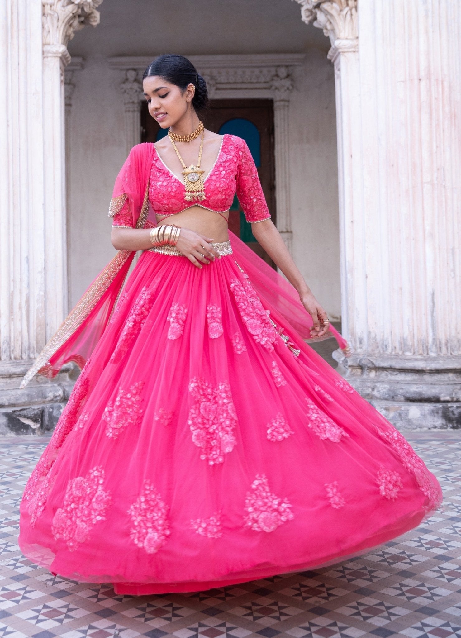 Raspberry pink embroidered lehenga with an open blouse neckline