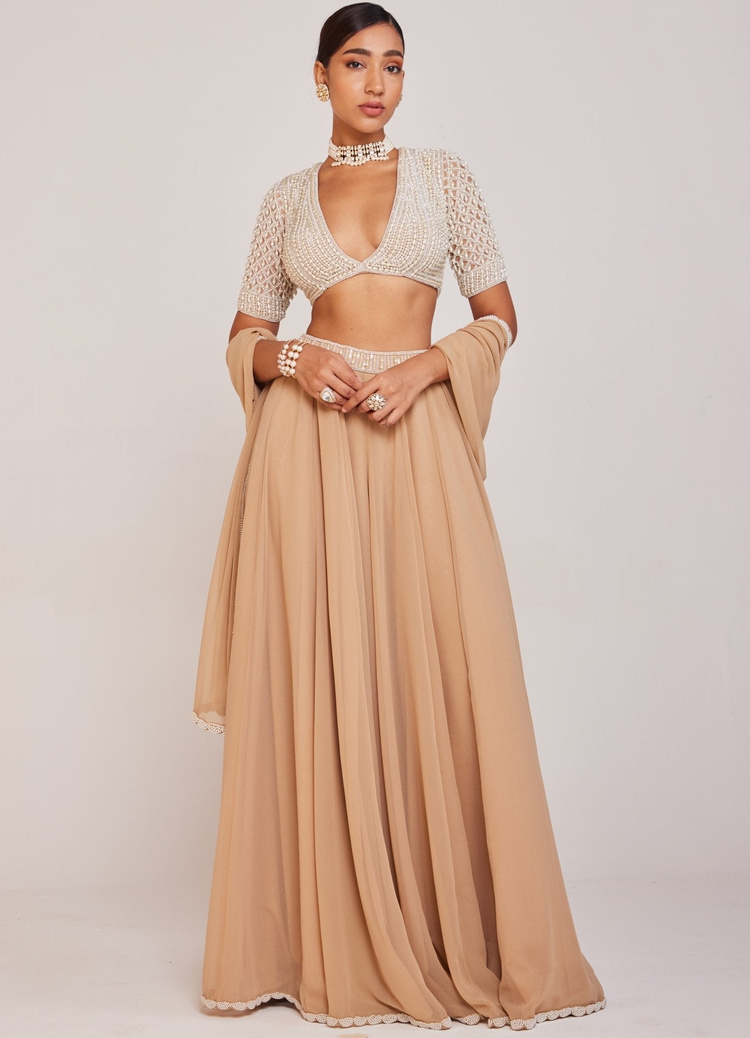 Beige georgette lehenga pant set with embellished blouse by Vvani Vats for reception