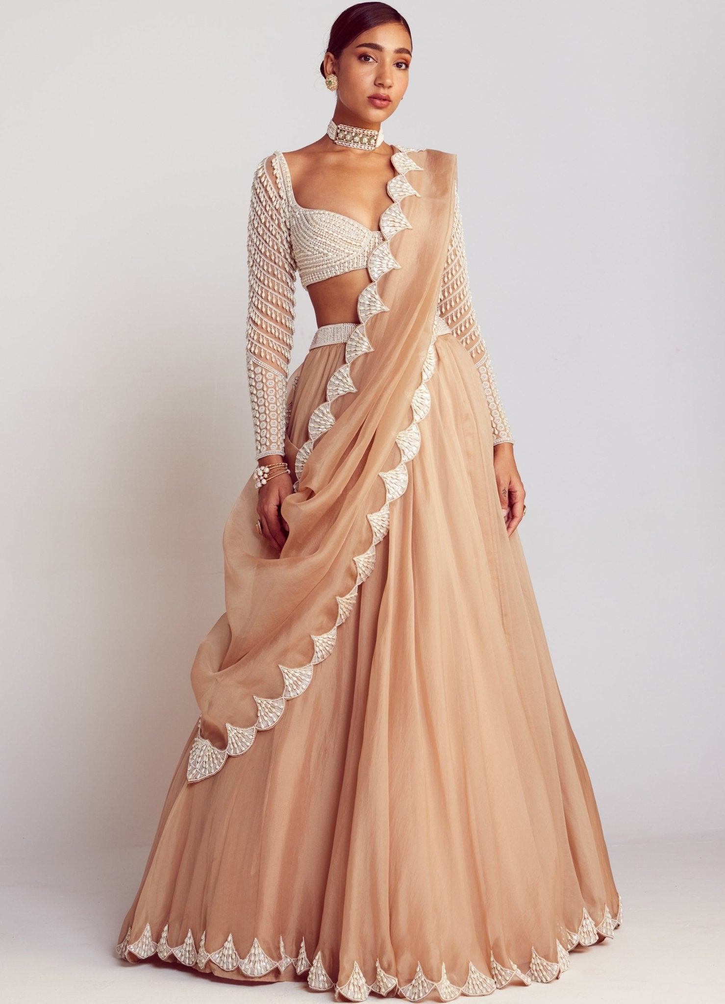 Beige pearl embellished lehenga — reception wedding guest outfit