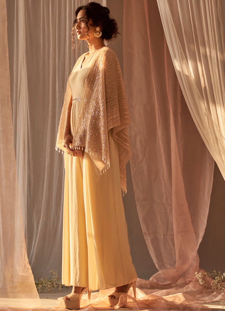 Champagne Crepe Jumpsuit With Cape And Belt Nidhika Shekhar - Fabilicious Fashion
