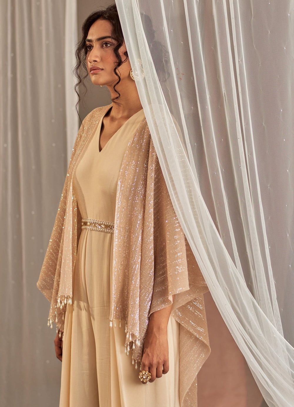 Champagne Crepe Jumpsuit With Cape And Belt Nidhika Shekhar - Fabilicious Fashion