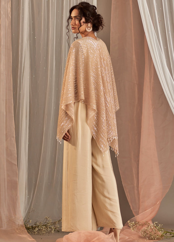 Champagne Crepe Jumpsuit With Cape And Belt Nidhika Shekhar - Fabilicious Fashion