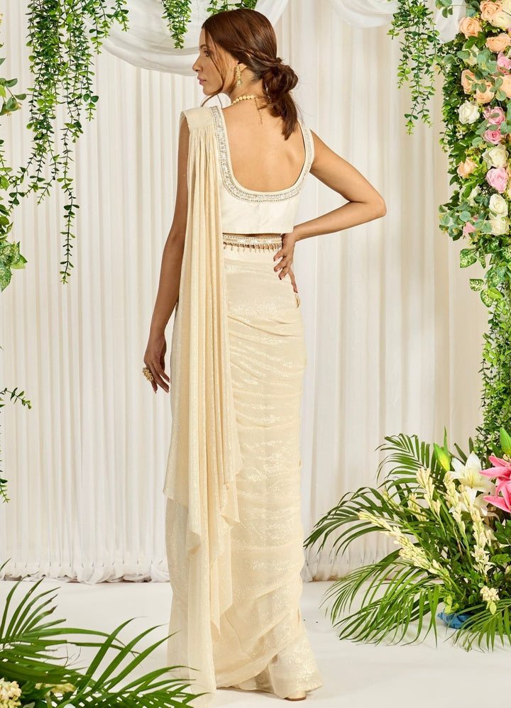 Ivory Georgette Saree With Embellished Blouse & Full Sleeved Cape Nidhika Shekhar - Fabilicious Fashion
