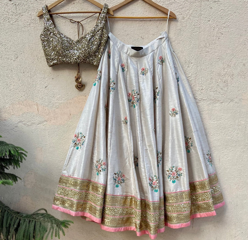 Ivory Raw Silk Lehenga With Floral Embroidery Priti Sahni - Fabilicious Fashion