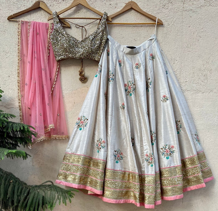 Ivory Raw Silk Lehenga With Floral Embroidery Priti Sahni - Fabilicious Fashion