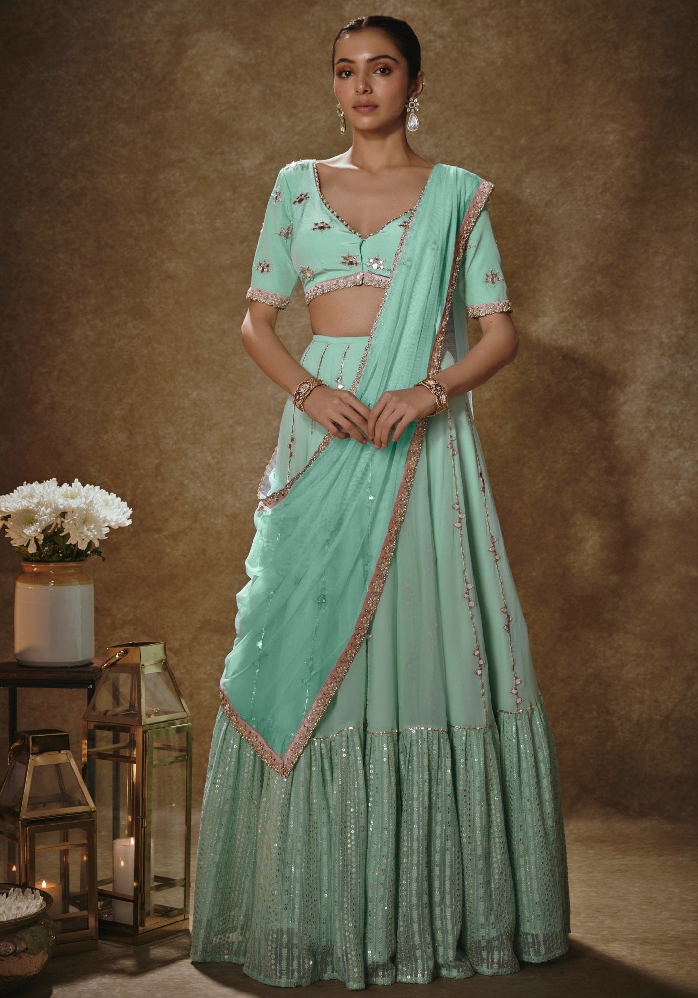 Mint green and gold embroidered lehenga for sister of the bride or groom