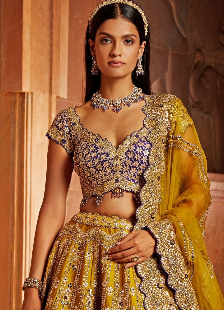Mustard Yellow Taffeta Lehenga With Purple Blouse and Mustard Yellow Dupatta Nitika Gujral - Fabilicious Fashion