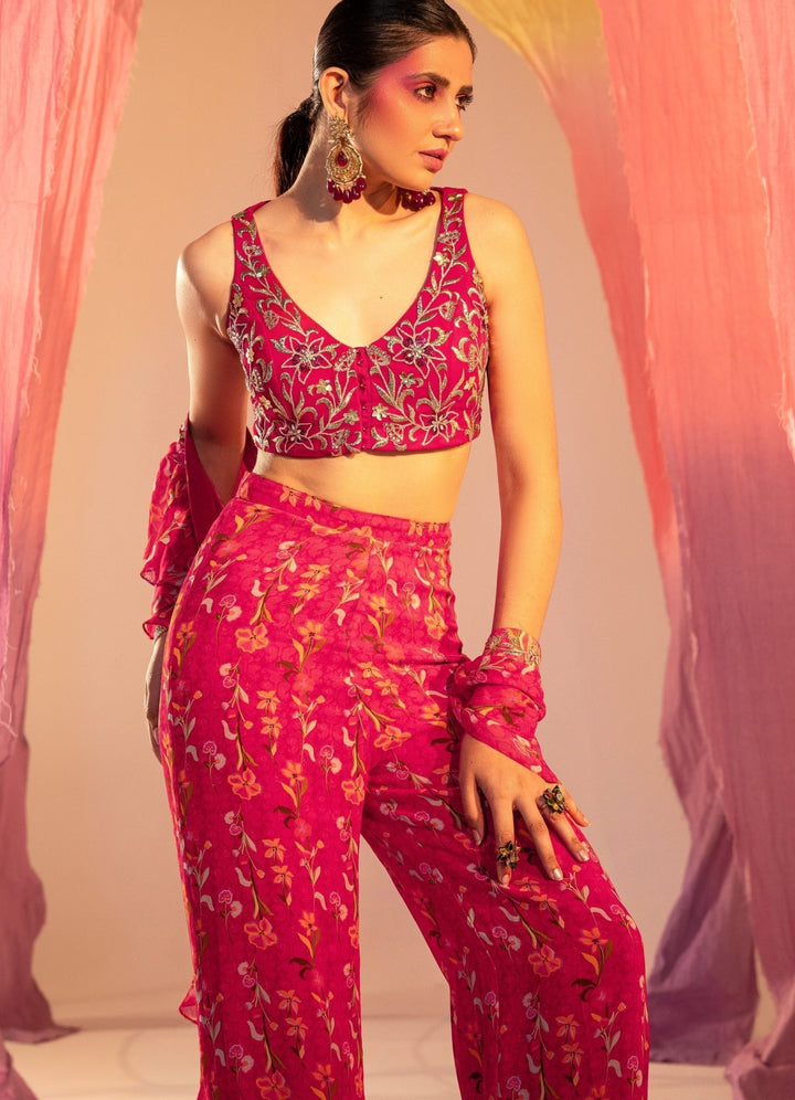 Rani Pink Embroidered Blouse And Printed Straight Pants With Frill Dupatta Set Silky Bindra - Fabilicious Fashion