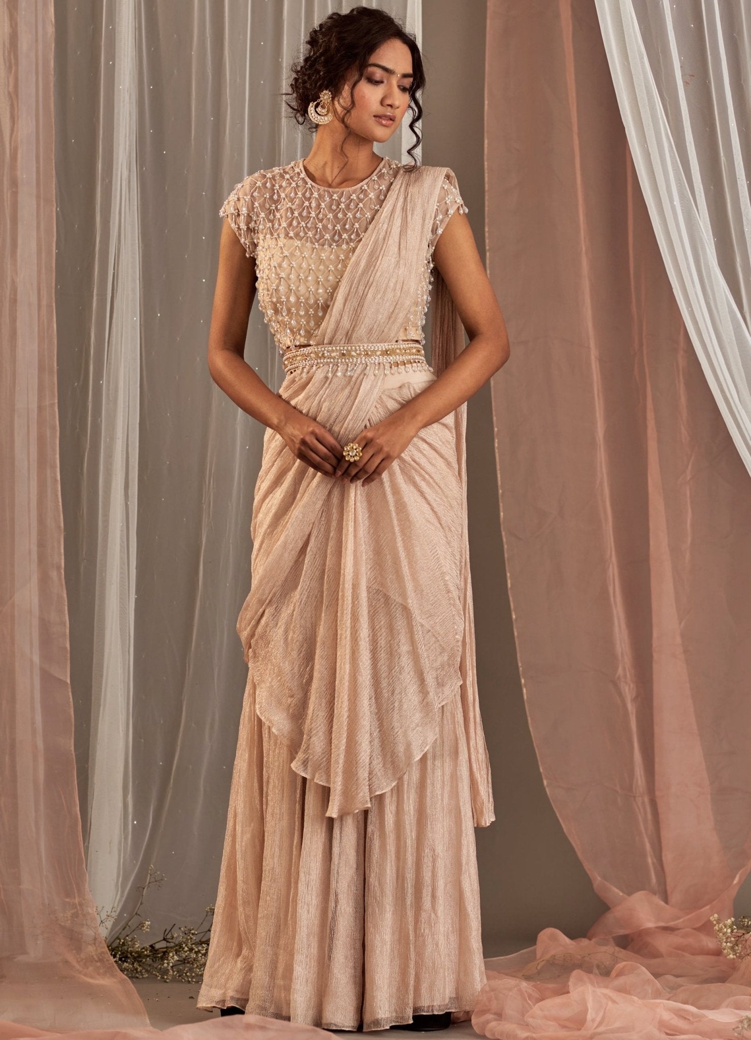 Rose champagne pre-draped tissue saree with tasseled blouse by Nidhika Shekhar — as worn by Brooke Taylor to her Walima