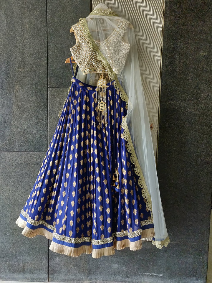 Royal Blue Ruffle Shimmer Lehenga Set with Mirror work Blouse and Off White Dupatta Priti Sahni - Fabilicious Fashion