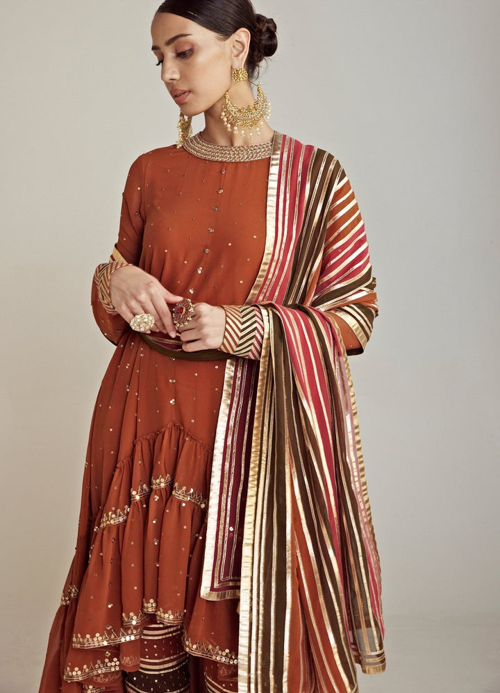 Rust Round Neck Asymmetrical Kurta Pant Set With Georgette Dupatta Vvani By Vani Vats - Fabilicious Fashion