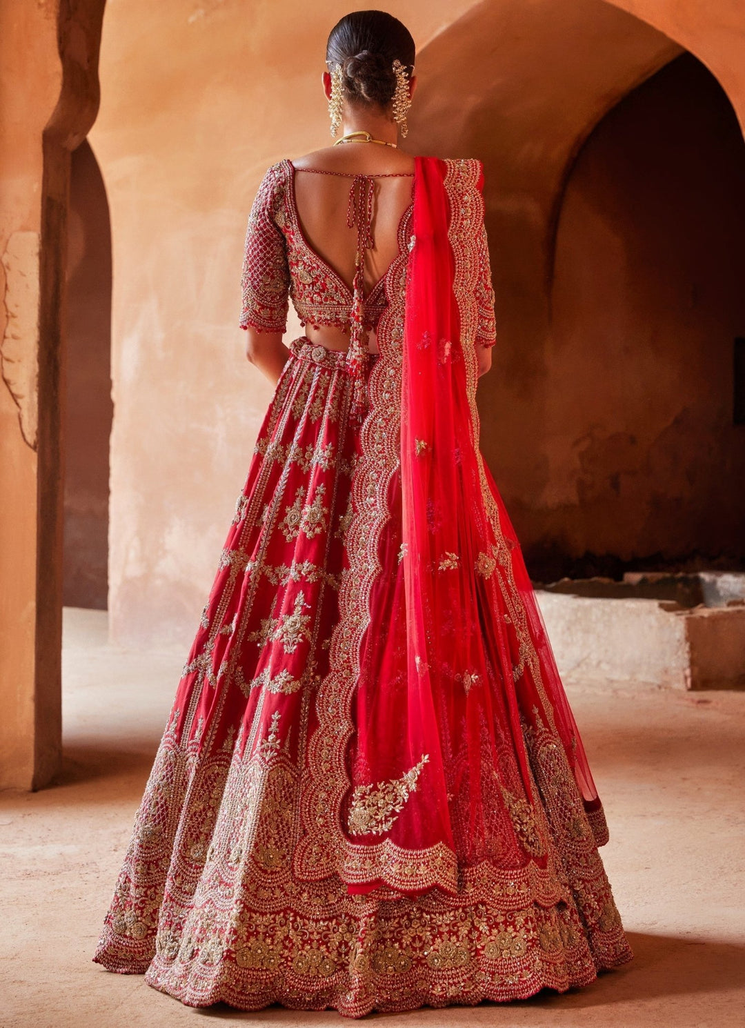 red bridal dress Dramatic beaded lace sleeveless fit and flare/trumpet wedding with train This fancy light ivory wedding dress features refined red lace appliques placed throughout the V neckline bodice and scattered onto the A Nitika Gujral Scarlet Red