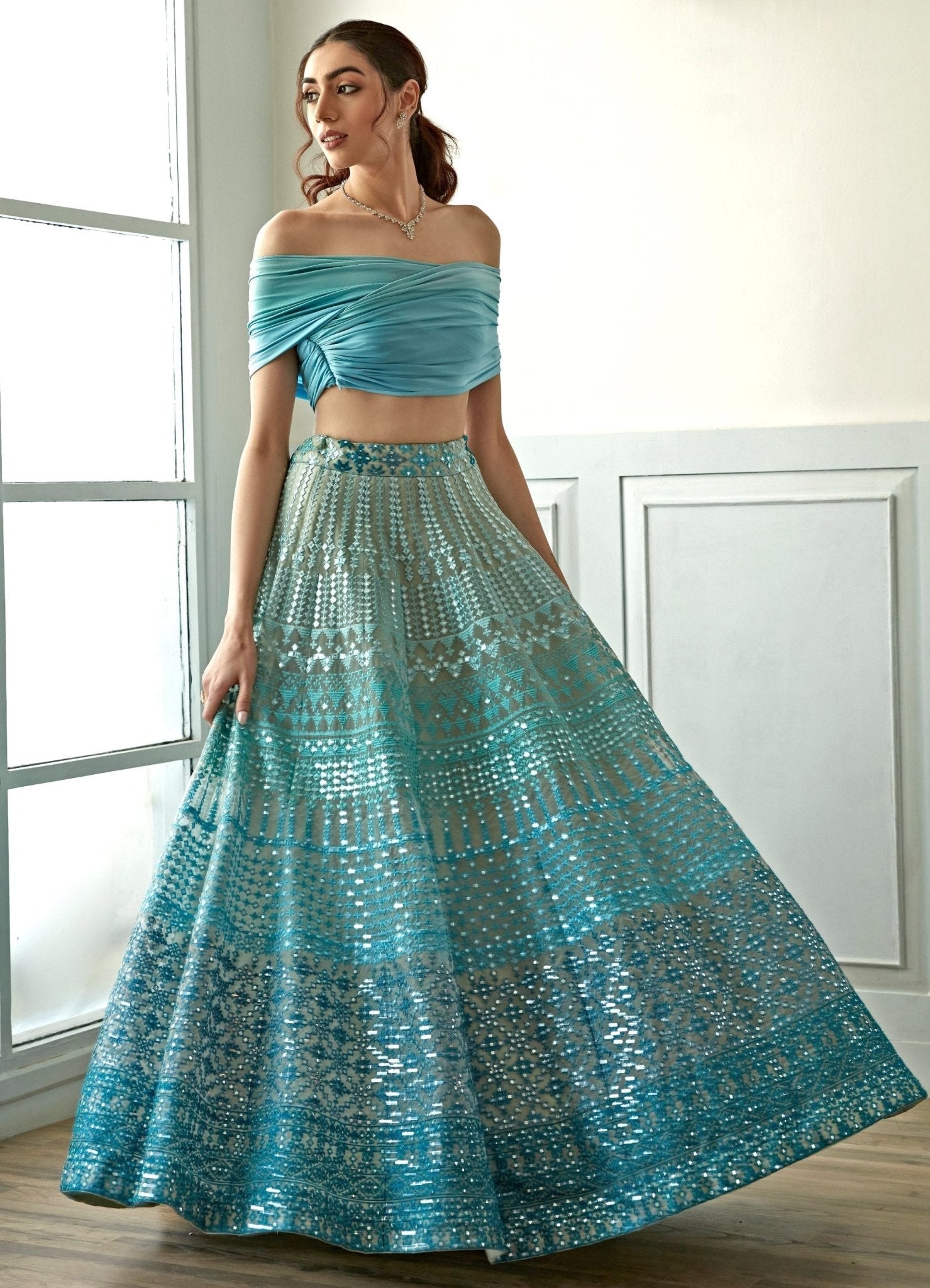 Sky blue off-shoulder lehenga set for pear-shaped body type with wide neckline