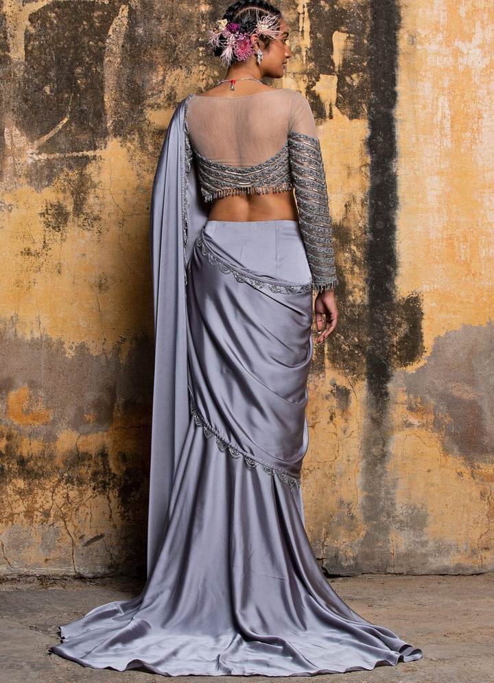 Steel Grey Drape Satin Saree With Nude Net Embellished Blouse Nitika Gujral - Fabilicious Fashion