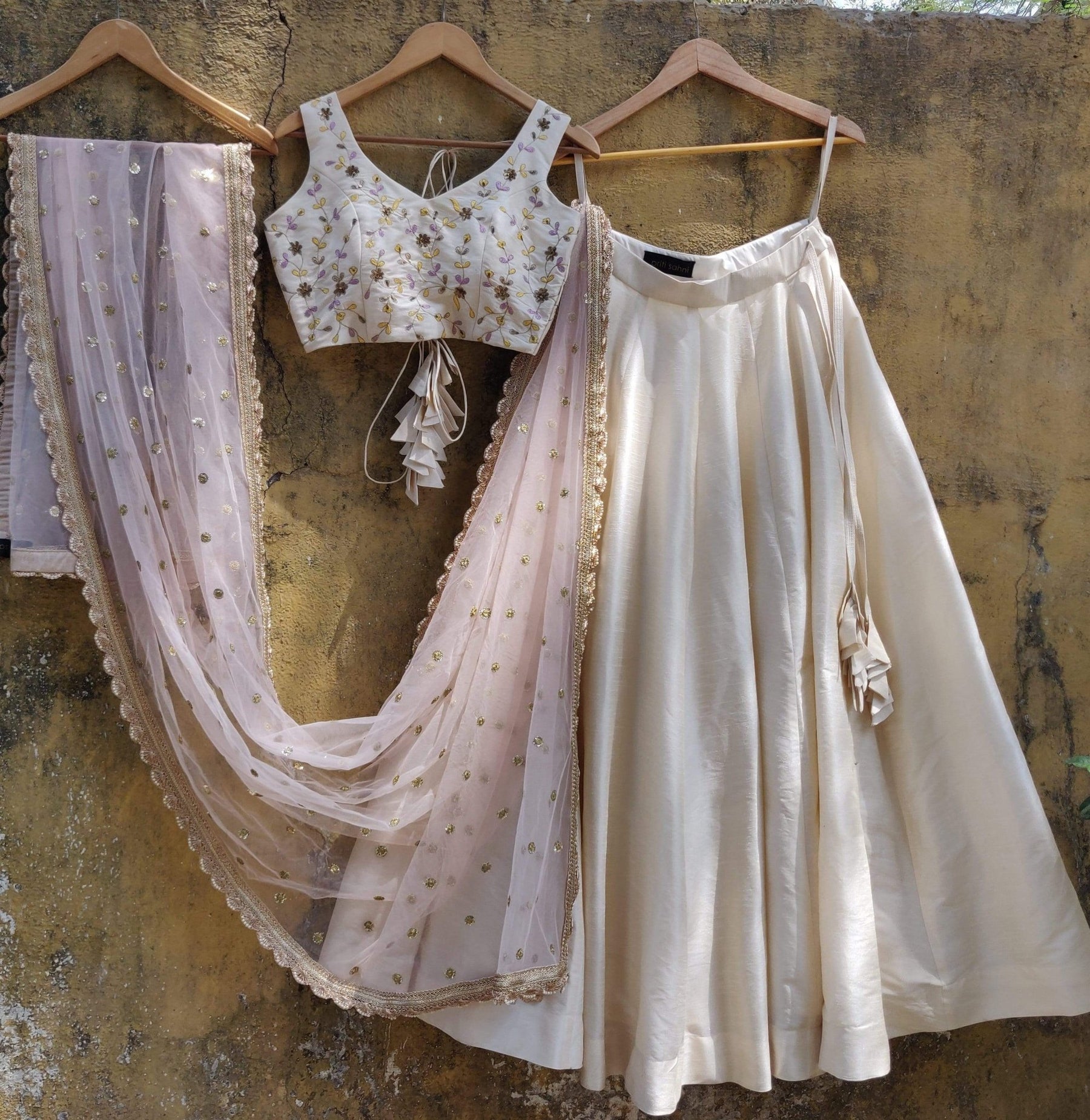 Affordable ivory wedding guest lehenga with blush pink dupatta