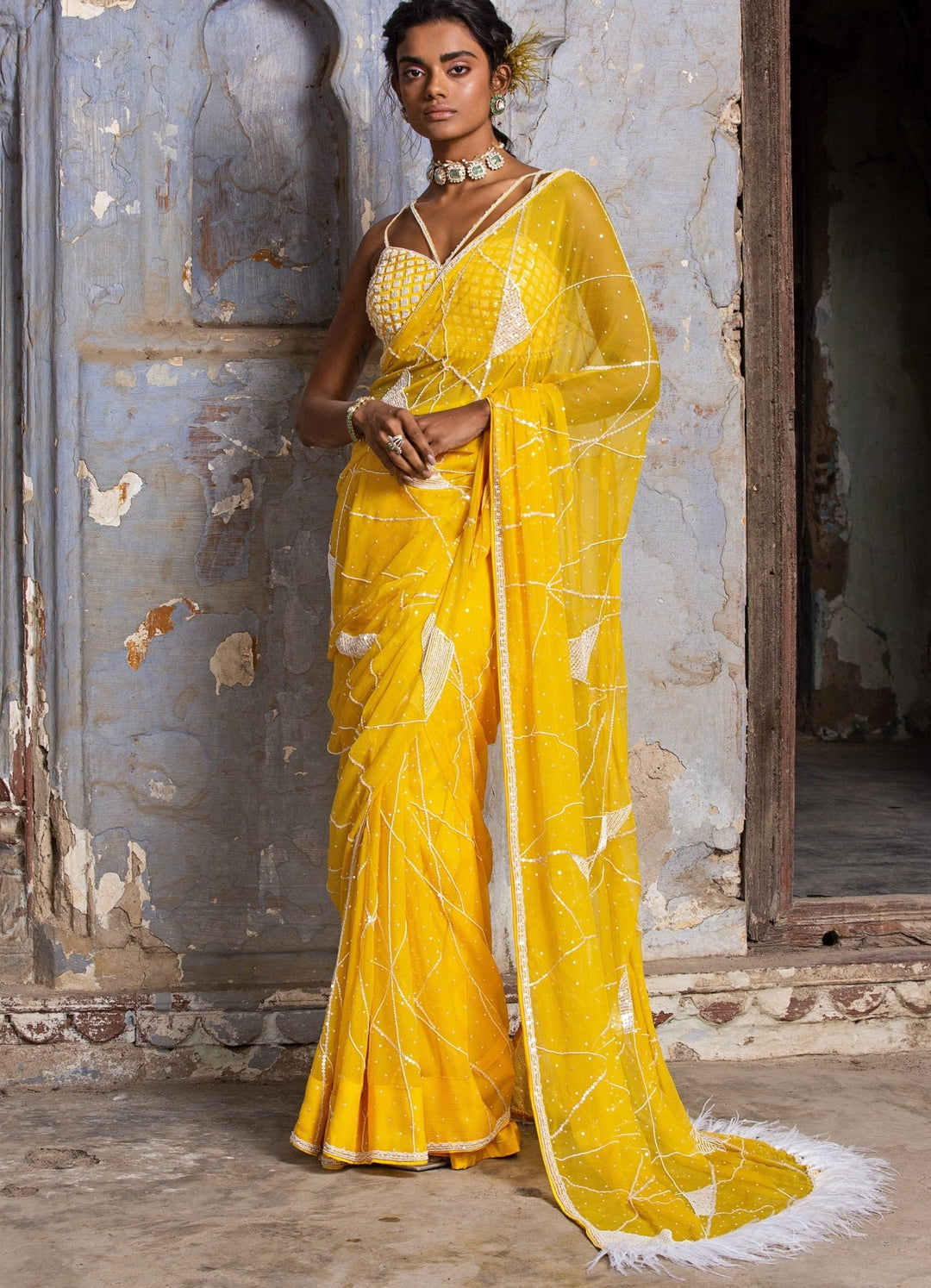 Sunshine Yellow Chiffon Saree With Feather Detail and Strappy Bustier Nitika Gujral - Fabilicious Fashion