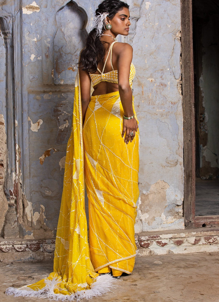 Sunshine Yellow Chiffon Saree With Feather Detail and Strappy Bustier Nitika Gujral - Fabilicious Fashion