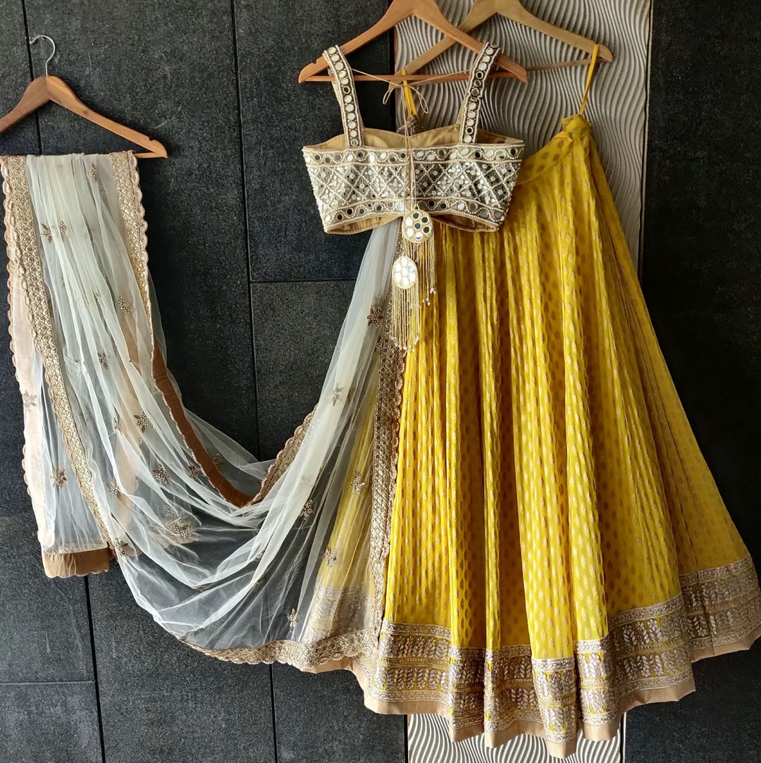 Sunshine Yellow Lehenga with Mirror work Bustier and Ivory Dupatta Priti Sahni - Fabilicious Fashion