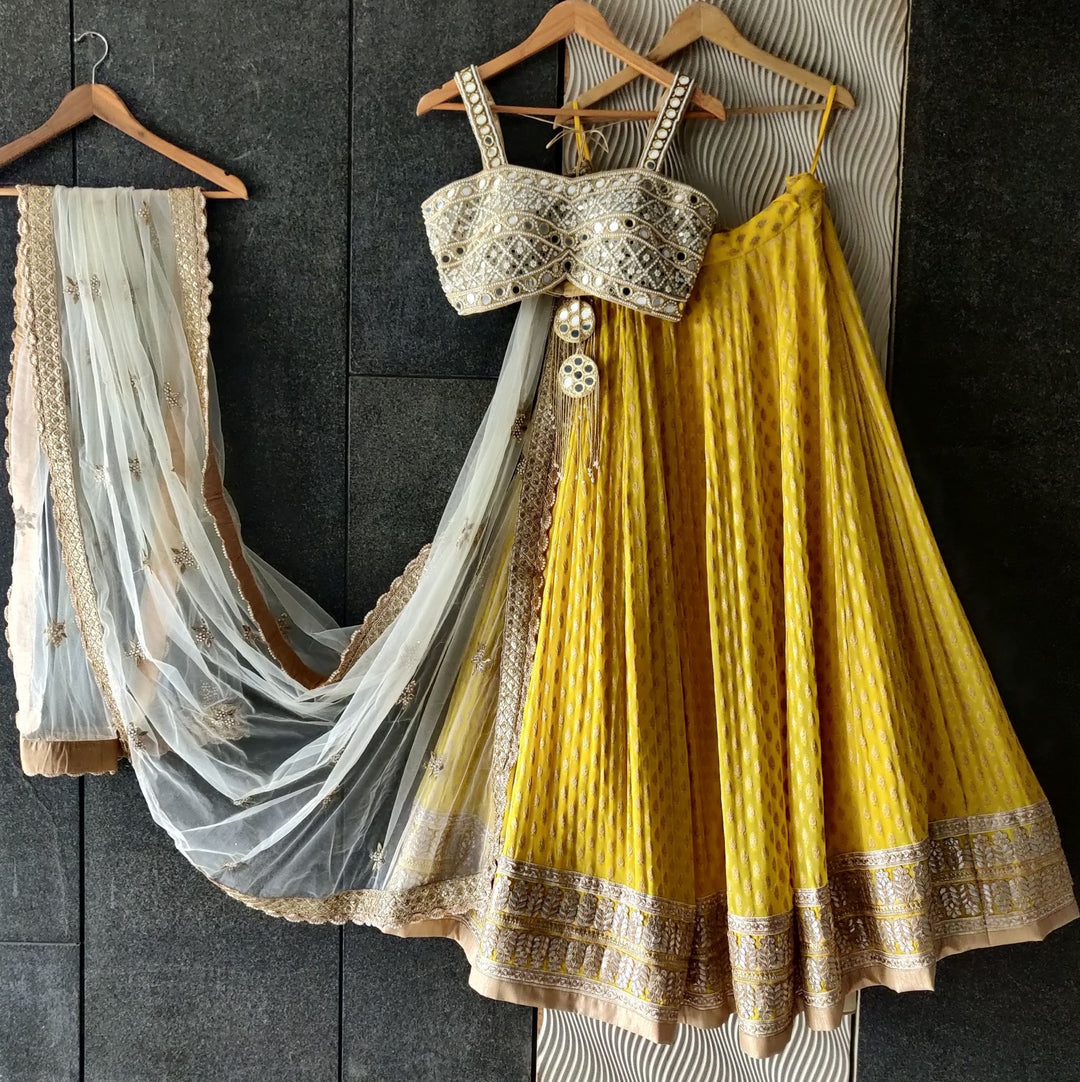 Sunshine Yellow Lehenga with Mirror work Bustier and Ivory Dupatta Priti Sahni - Fabilicious Fashion
