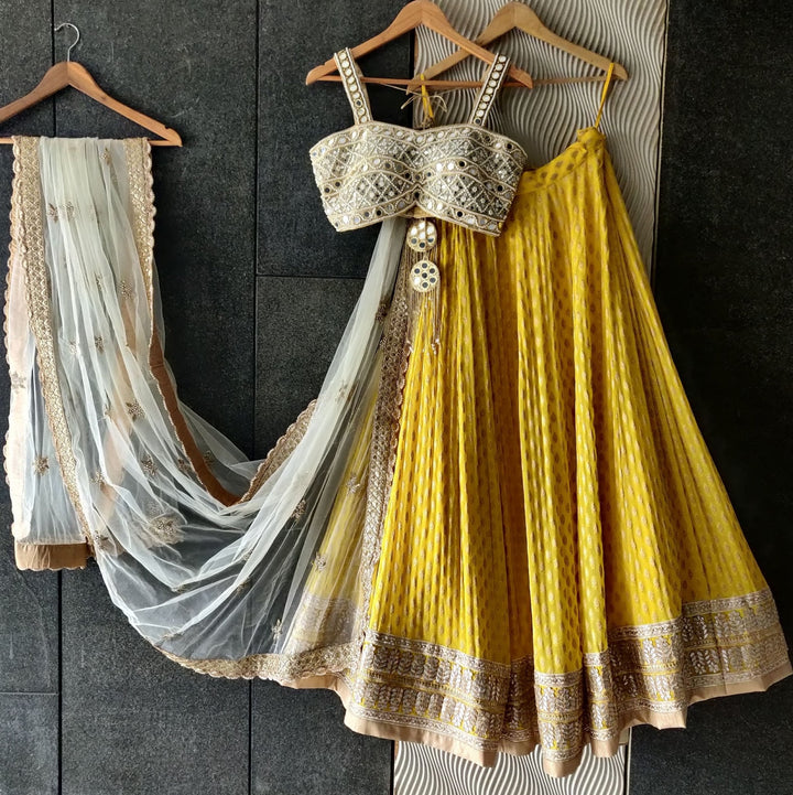 Sunshine Yellow Lehenga with Mirror work Bustier and Ivory Dupatta Priti Sahni - Fabilicious Fashion