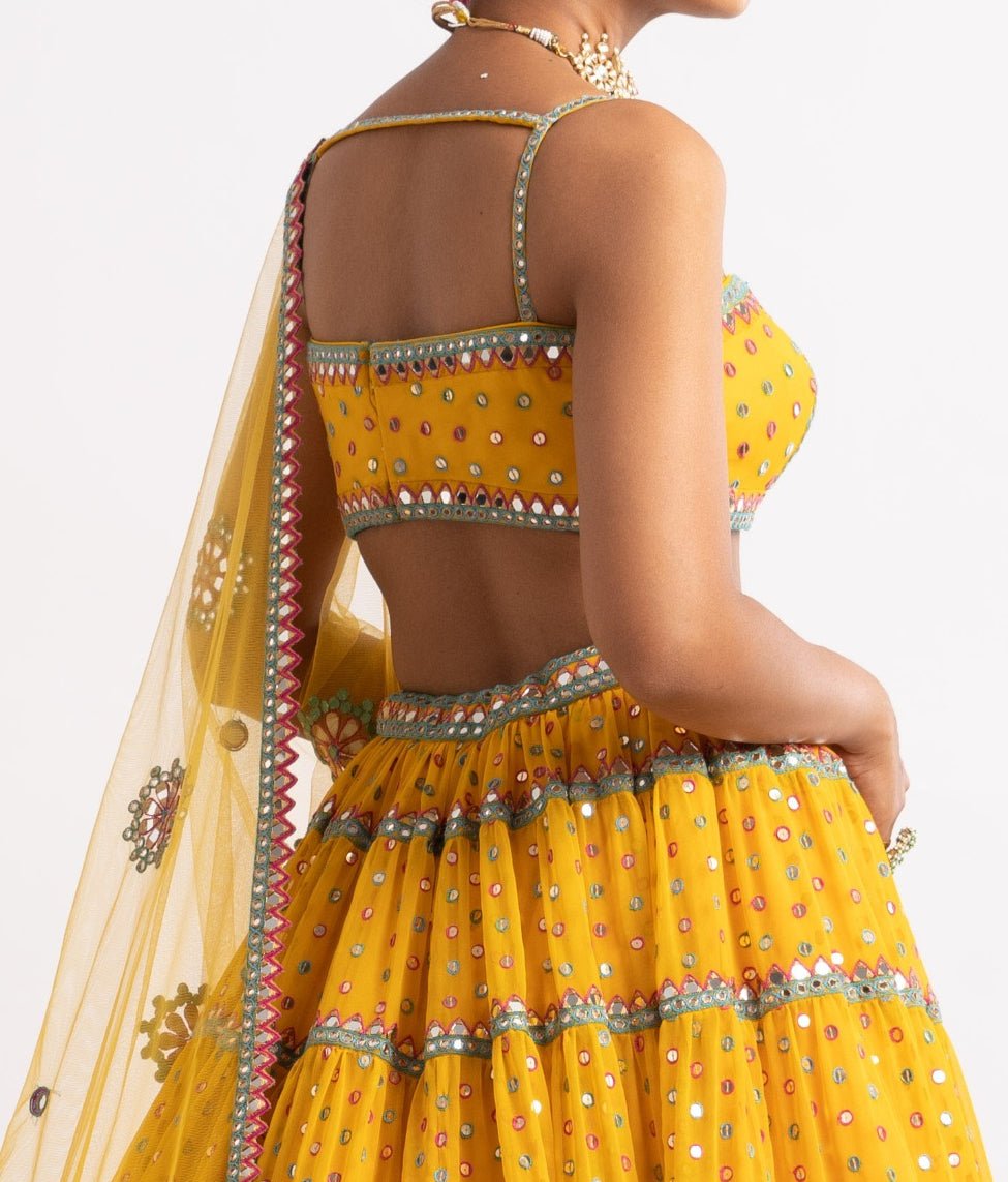 Yellow Strappy Blouse and Tiered Lehenga Set Vvani by Vani Vats - Fabilicious Fashion